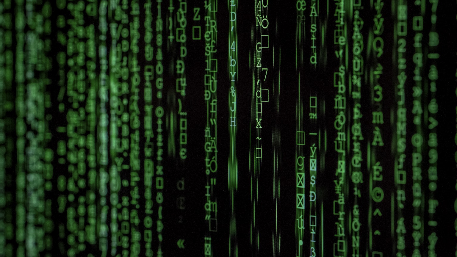 Electric-blue lines of code on a dark screen, representing a Claude agent loop written in TypeScript