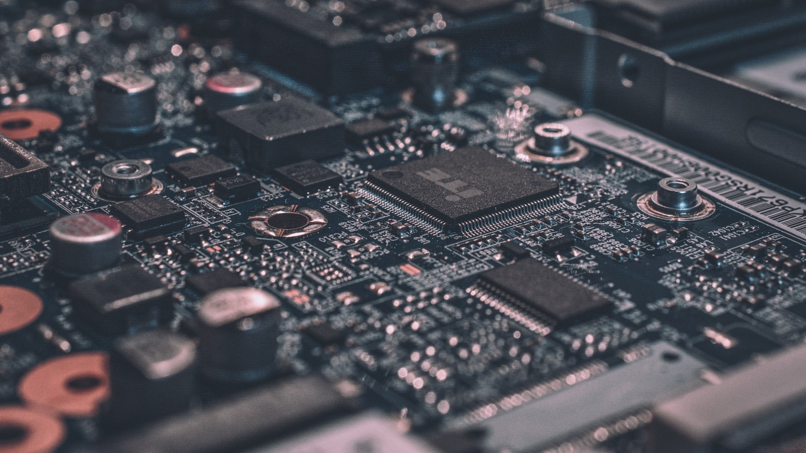 Close-up of a blue circuit board, representing deterministic hook checkpoints that intercept an AI agent's tool calls at fixed points