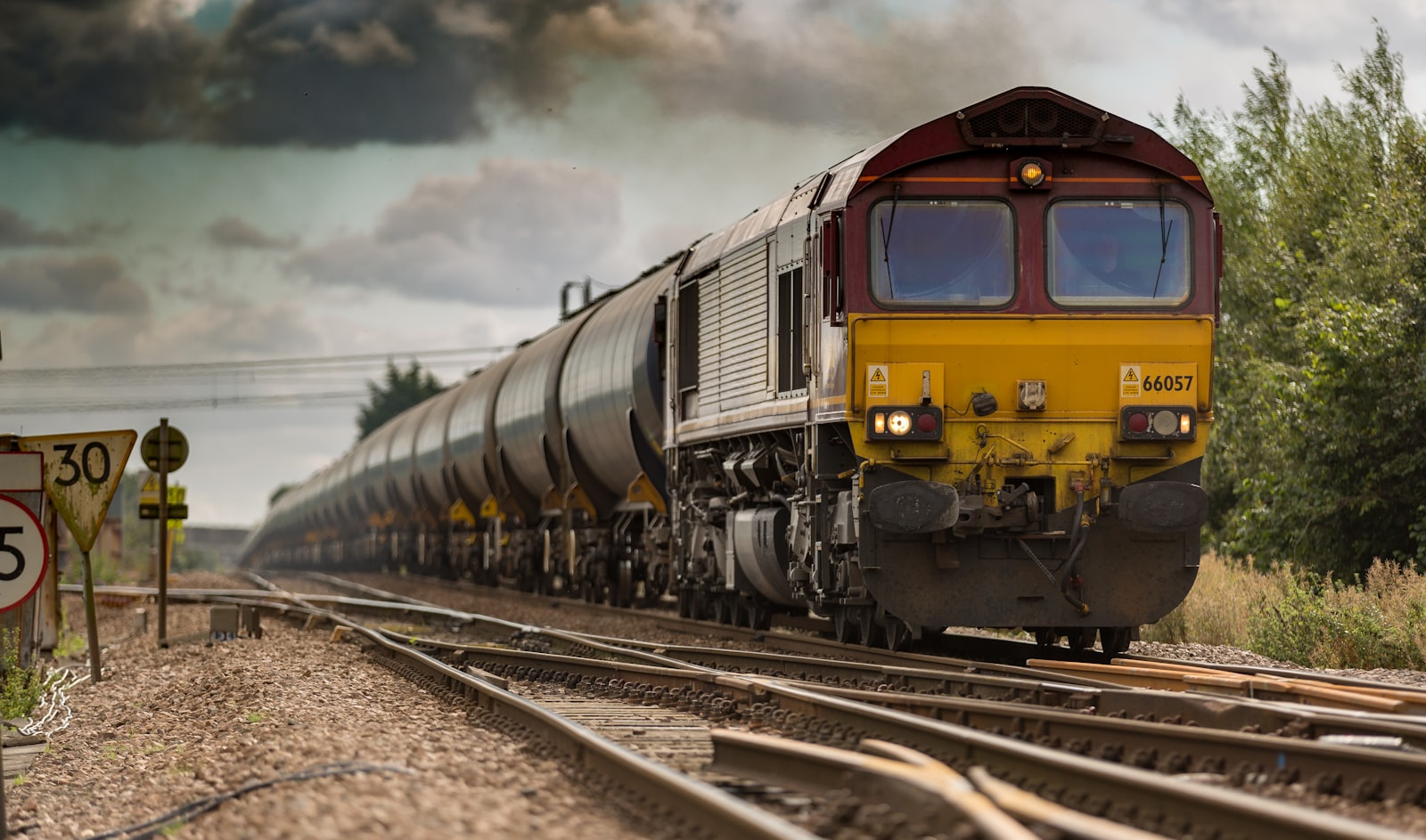 Parallel railway tracks converging into a single line, evoking how parallel LangGraph nodes must merge their updates into one state key through a reducer.